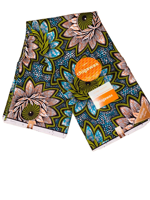 Bold green and peach floral Ankara fabric in image