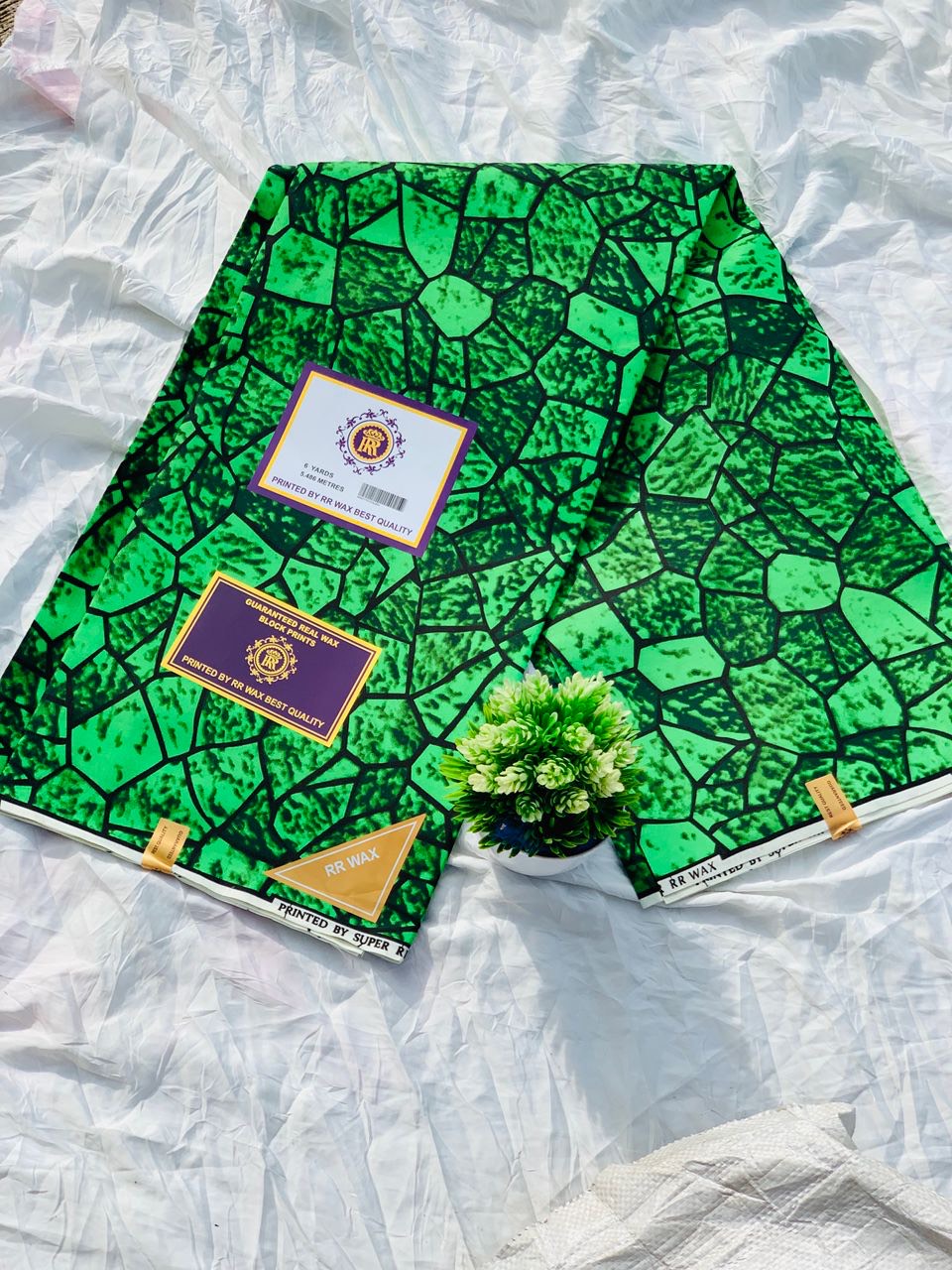Vibrant green stone-pattern Ankara wax print