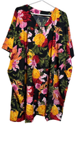 Two-piece tropical floral co-ord set showing matching wide-leg elasticated pants and draped kimono-style top styled together
