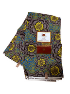 Brown, yellow, and teal floral Ankara fabric in image