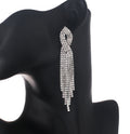 Sparkling twisted crystal tassel statement earrings