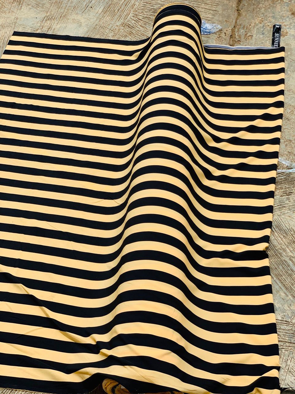 Black and yellow striped crepe fabric